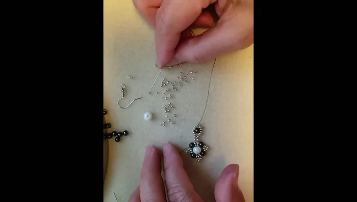 Repeat the sequence of adding 1 size 11 seed bead, one hematite bead, and three size 11 seed beads. Repeat this section three times.