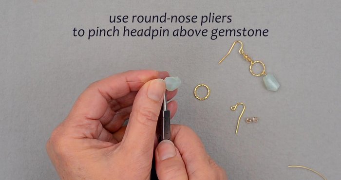 Secure the loop: Wrap the wire tail around the loop twice, snug against the gemstone. Trim the excess wire.