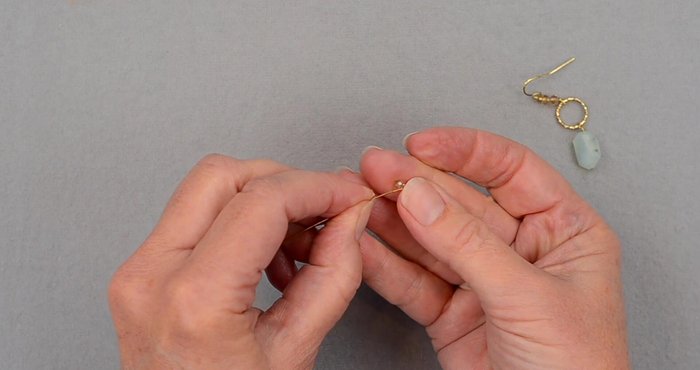 Attach crystals to connector: Add two crystals onto the wire. Make another wrapped loop as in step 2 & 3.