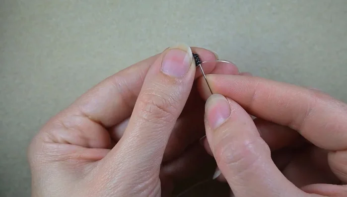 Repeat step 3 multiple times to create the rows of red beads.