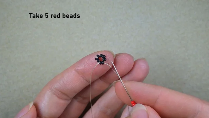 Repeat step 3 multiple times to create the rows of red beads.