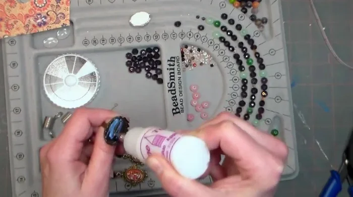 Assemble ring: Attach bobble to ring setting using glue.