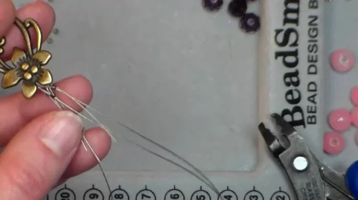 String beads: String beads onto each wire, ensuring even lengths and spacing.