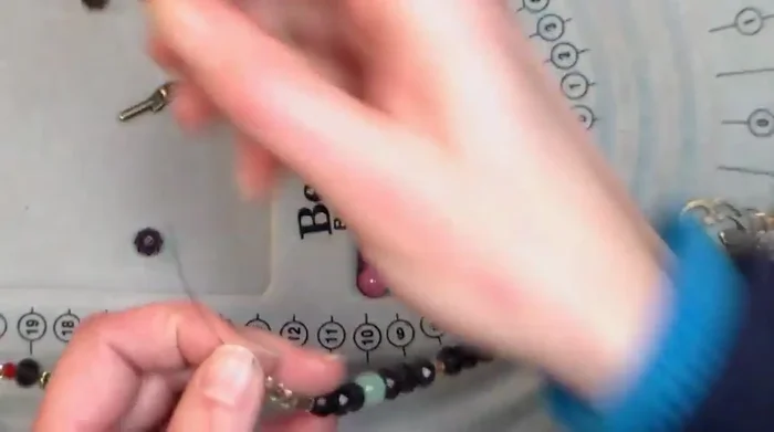 Attach toggle clasp: Attach the other end of the toggle clasp, using the same crimp bead method as step 6.