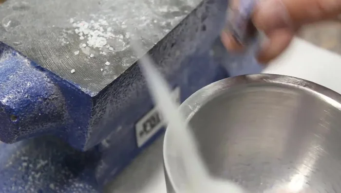 Add thin CA glue droplets to secure the dust and further fill any gaps.