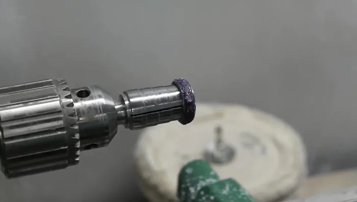 Use a lathe with a carbide rougher to shape the ring, removing excess material down to the tungsten blank.