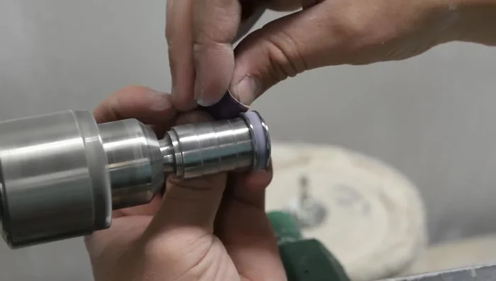 Sand and polish the ring, starting with 150 grit sandpaper and progressing to 2400 grit or higher.