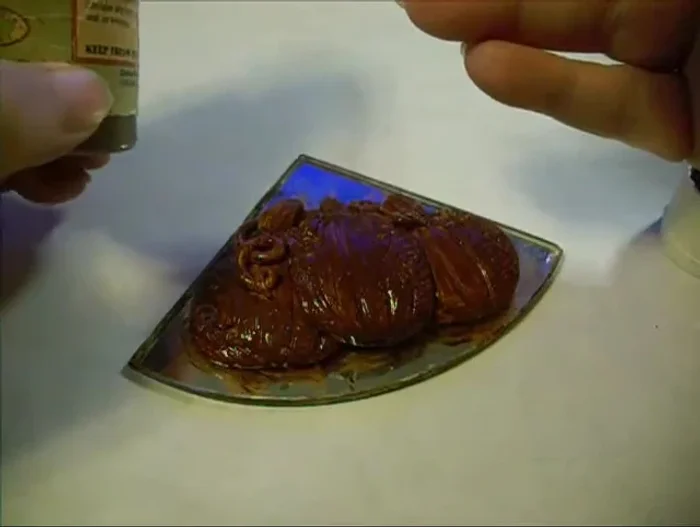 Apply antiquing gel and wipe off excess while partially tacky for an aged look.