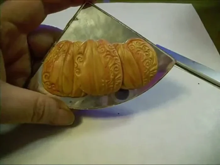 Add stems to each pumpkin using small pieces of clay.