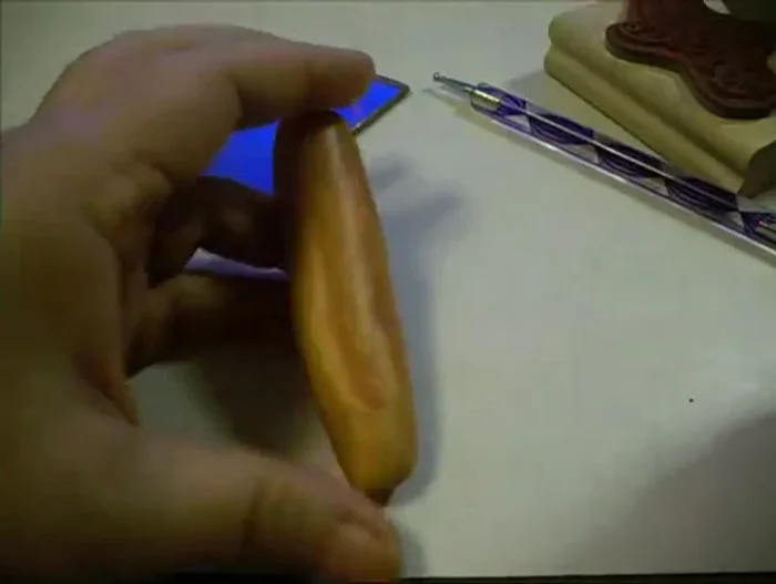 Shape the clay into a rough pumpkin form.