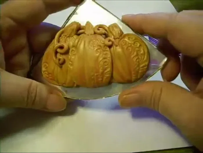 Bake the pumpkins according to clay manufacturer's instructions.