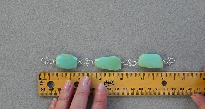 Measure the length of the completed beaded section. Cut a length of chain to achieve your desired necklace length (approximately 18 inches).