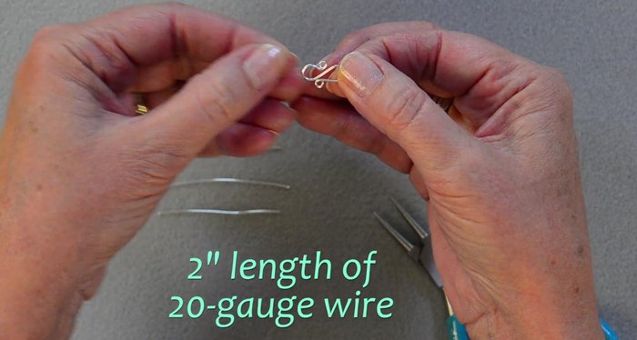 Make four 'S' connectors using 2-inch lengths of 20-gauge wire. Follow the four-step process: small loop, large loop, large loop (opposite direction), small loop.