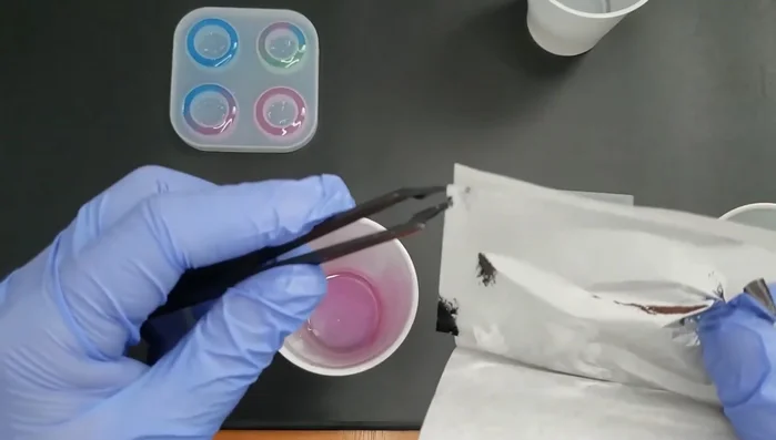 Add decorations (optional): Carefully add gold foil leaves or other desired decorations to the resin while it's still wet.