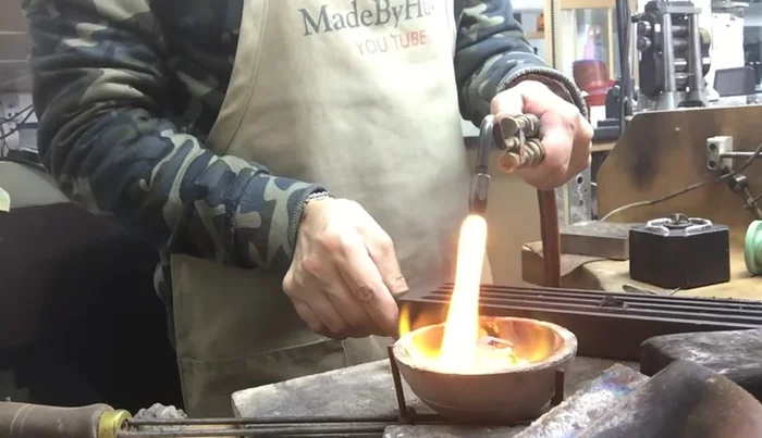 Prepare the silver: Add borax and flux to help the silver flow, and oil to the skillet for smoother work.