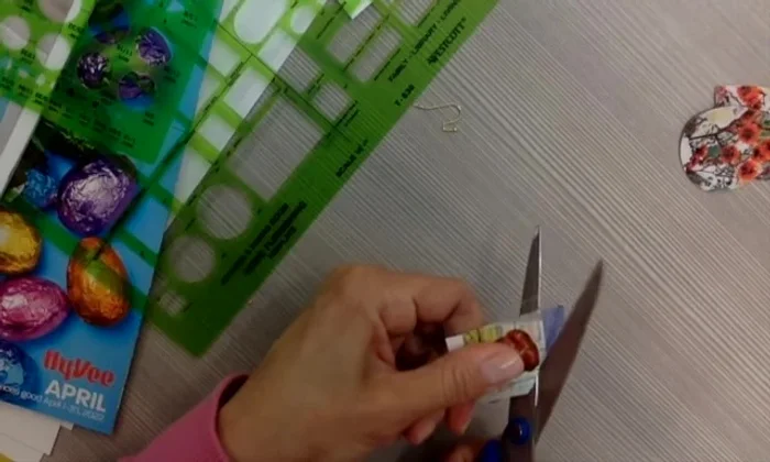 Carefully cut around the laminated cutout using the sharp point of the scissors.