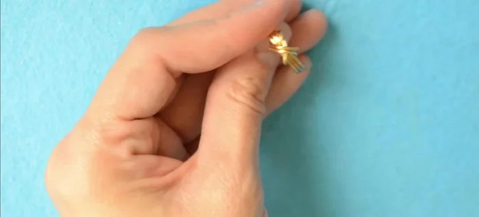 Cut the excess wire, hide the ends, and optionally file them smooth to prevent scratches.