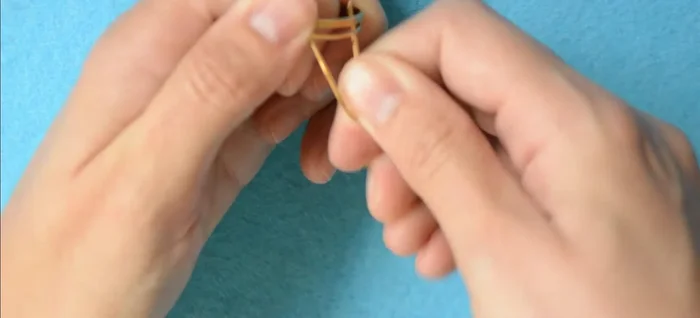 Hold the center tightly and wrap one side around it, using flat nose pliers for better fastening.
