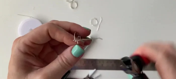 Bend the remaining wire ends around the main wire to secure the connection.