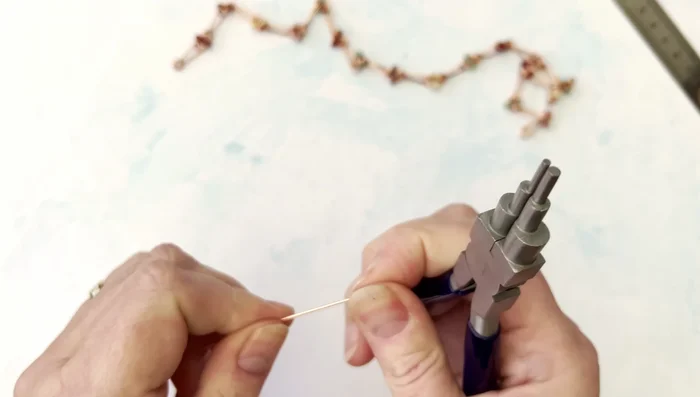 Using chain nose pliers (or similar), create a small loop at each end of the wire. Ensure the loops face away from you.