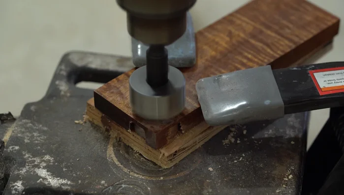 Cut out rough ring blanks using hole saws in the koa wood.