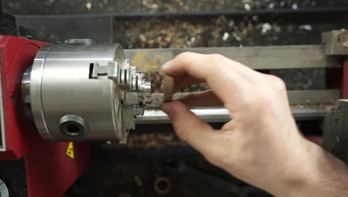 Glue the koa wood halves onto the titanium ring using super thin CA adhesive.