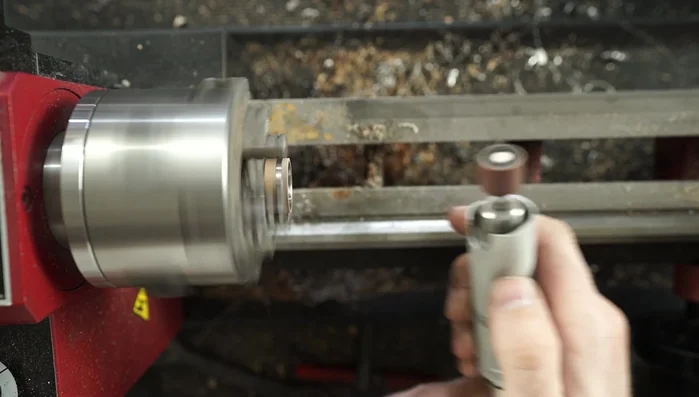 Apply a brushed finish to the titanium using 400 grit sandpaper.