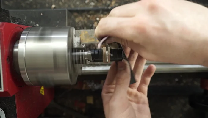 Remove excess CA adhesive from the titanium using a razor blade.