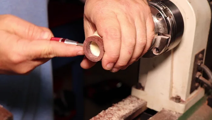 Sand the blank to exactly 6 millimeters to ensure a tight fit with the metal core pieces.