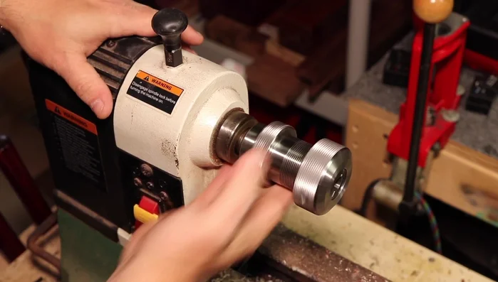 Turn the ring blank down to the proper size, flush with the core pieces.