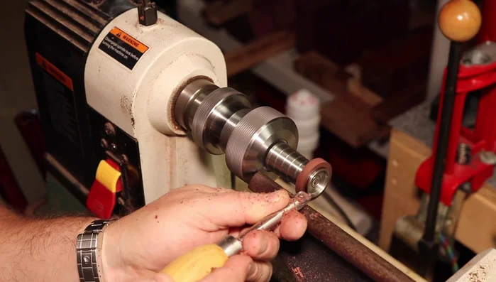 Turn the ring blank down to the proper size, flush with the core pieces.