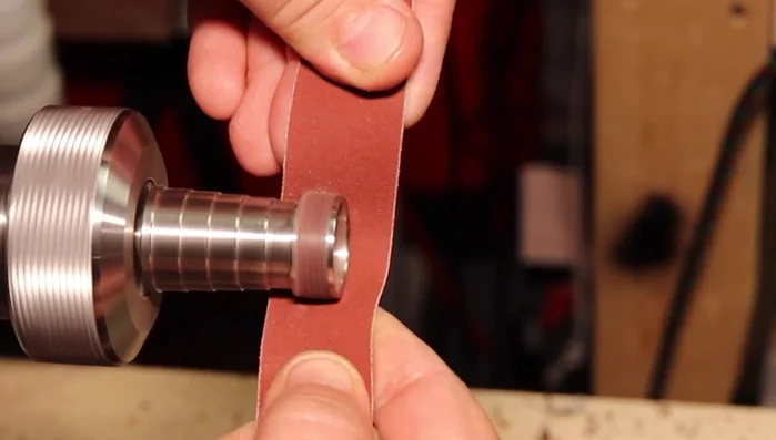 Polish the inside of the ring using a Dremel wheel and plastic scratch-free polish.