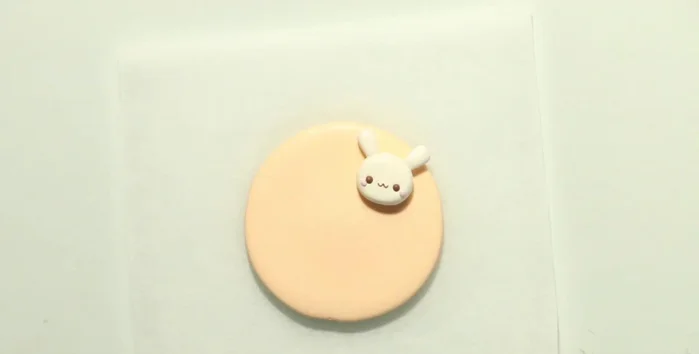 Assemble decorations onto clay backings, leaving space for names.