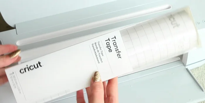 Apply vinyl names to clay backings using transfer tape.