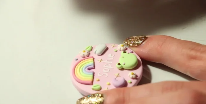 Attach finished badges to card stock backings mounted on thicker cardboard for sturdiness.