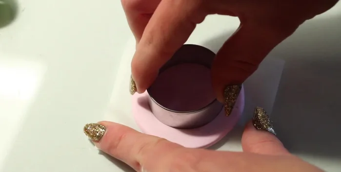 Create indentations for gold backings and remove excess clay.