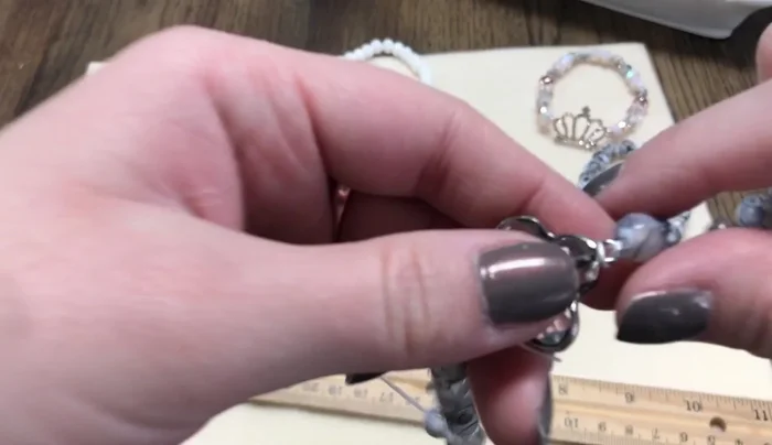 Tie off: Tie the remaining cord tails together with three knots to create a secure fastening.