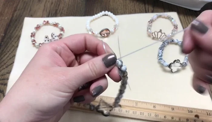 Tie off: Tie the remaining cord tails together with three knots to create a secure fastening.