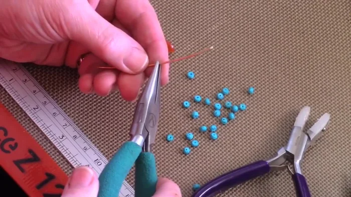 Prepare the earring frame: Cut 3 inches of 18 gauge wire and bend it in half to create a symmetrical shape. Compare it to your first earring (if making a pair) for evenness.