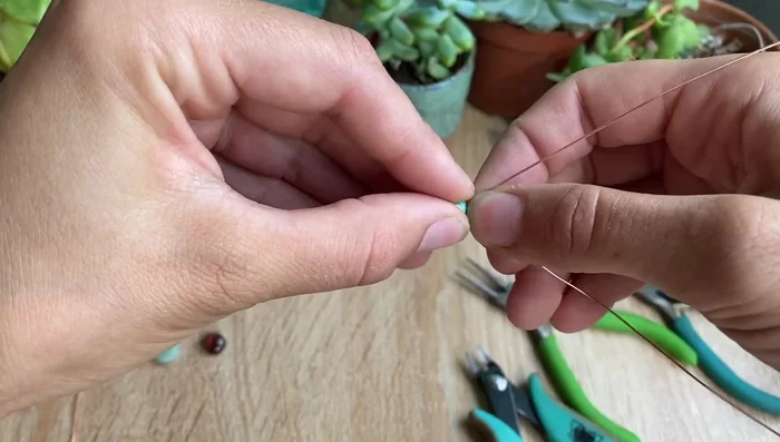 Twist the two wires together, keeping them at a similar angle to prevent uneven twisting.