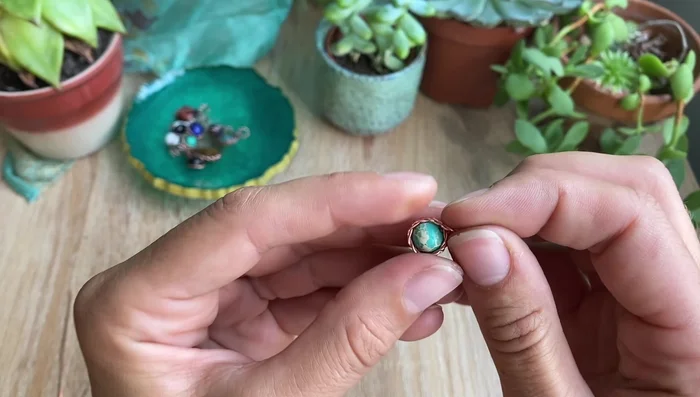 Secure the twisted wire with 28 gauge weaving wire, wrapping it around both wires at the top several times to prevent unraveling.