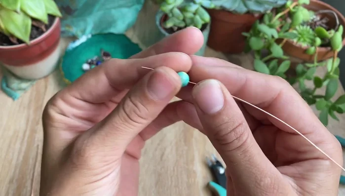 Fold one wire towards the top.