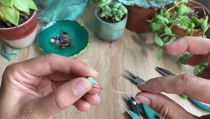 Fold one wire towards the top.