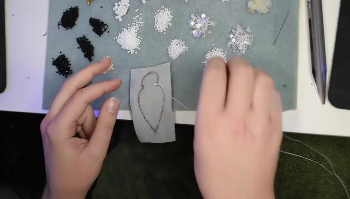 Bead and sequin the spider's head using a layering technique (sequins, then bead to secure).