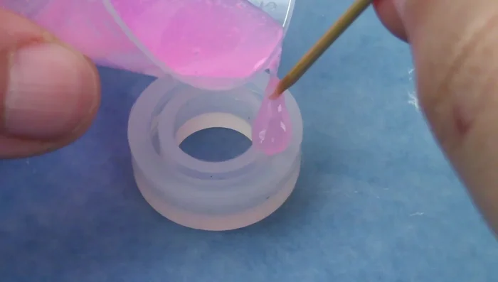 Add embellishments (optional): Incorporate gold flakes, glitter, dried flowers, or other desired elements.