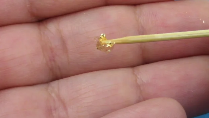 Add embellishments (optional): Incorporate gold flakes, glitter, dried flowers, or other desired elements.