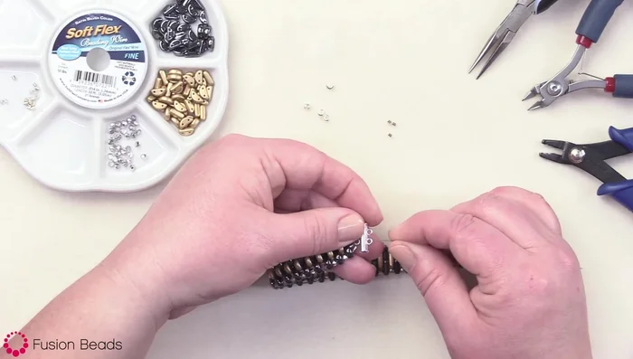 Add a crimp bead to each end, threading through the loop and back through the crimp bead. Crimp securely.