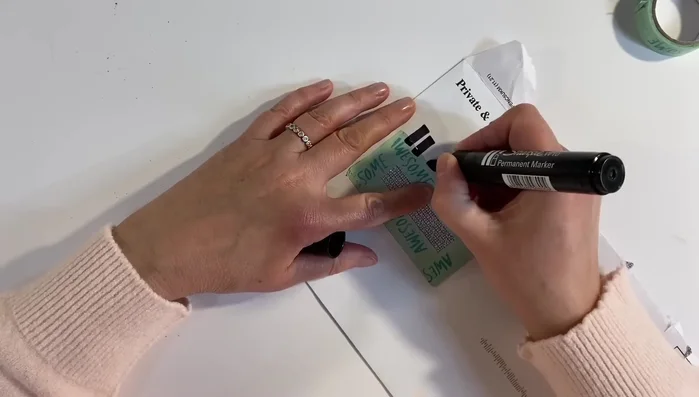 Peel away the washi tape from the inside of the envelope.