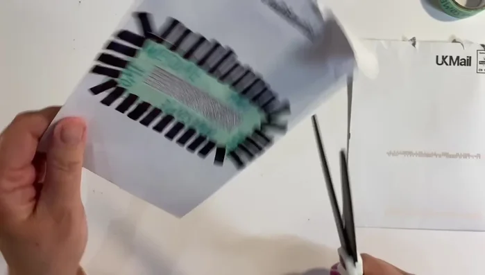 Peel away the washi tape from the inside of the envelope.