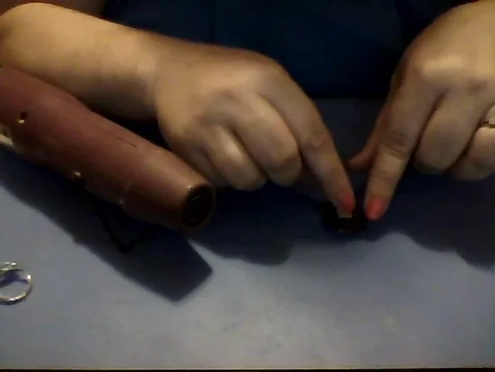 Place a small amount of the heated No-Days Bail Bond in the center of the ring setting.